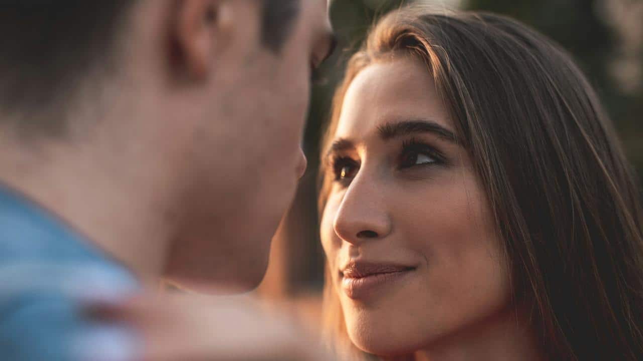 A young man and a woman looking at each other with love.