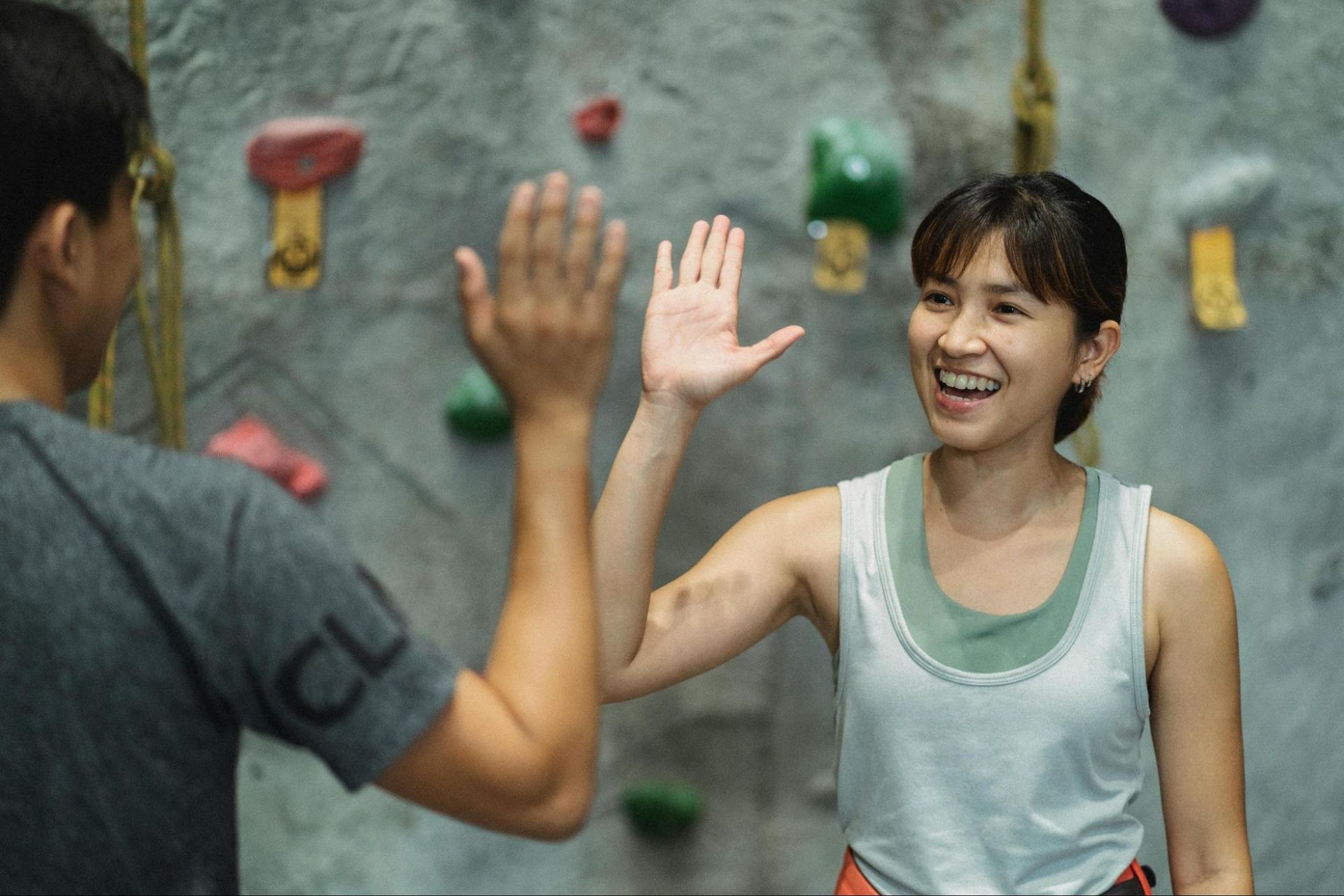 Woman high-fiving a man