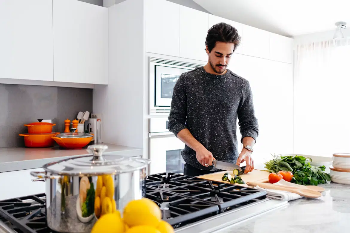A man in love cooking food for his partner.