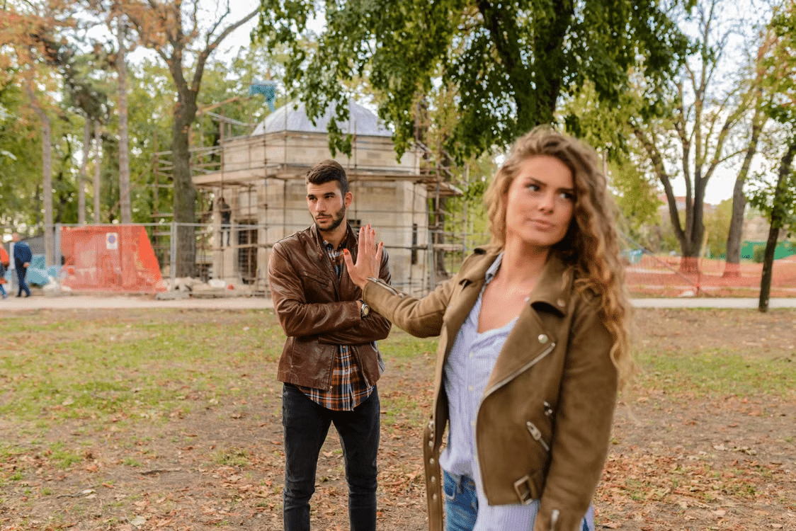 A woman setting a boundary with a man.