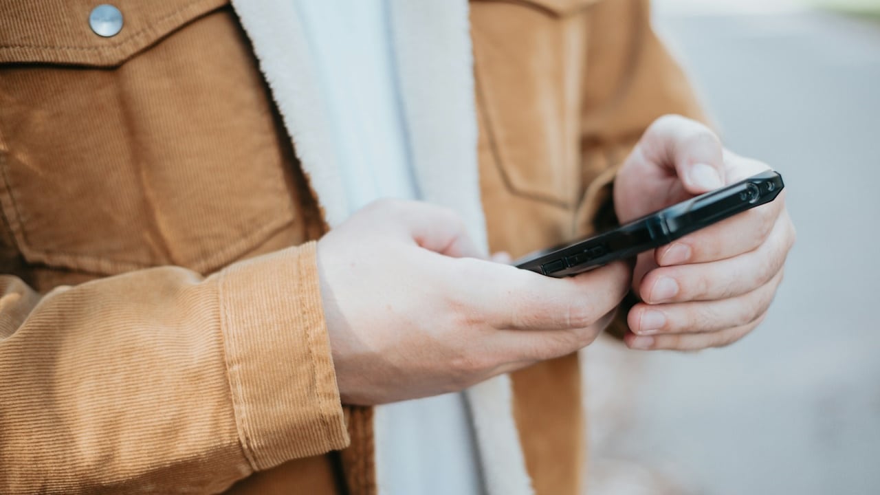 A man texting on his phone.