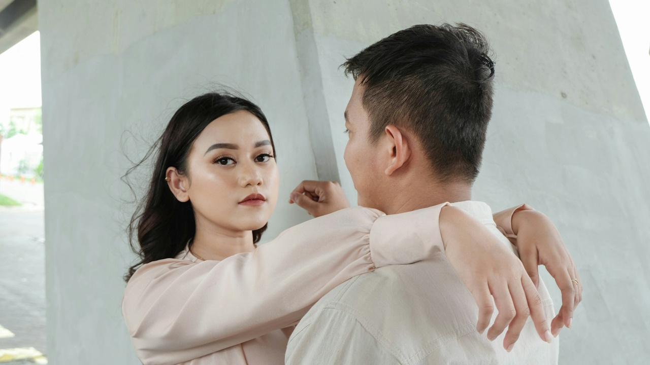 A man and a woman standing next to each other.