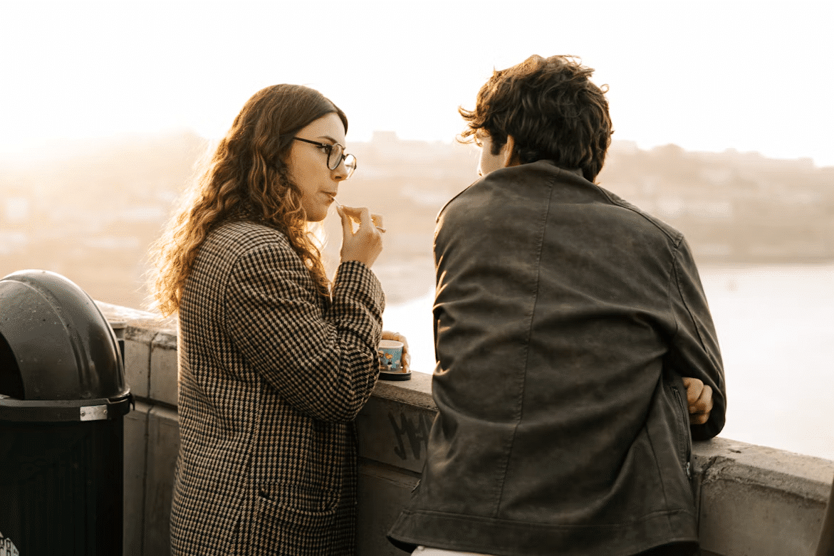A woman listening closely to a man.