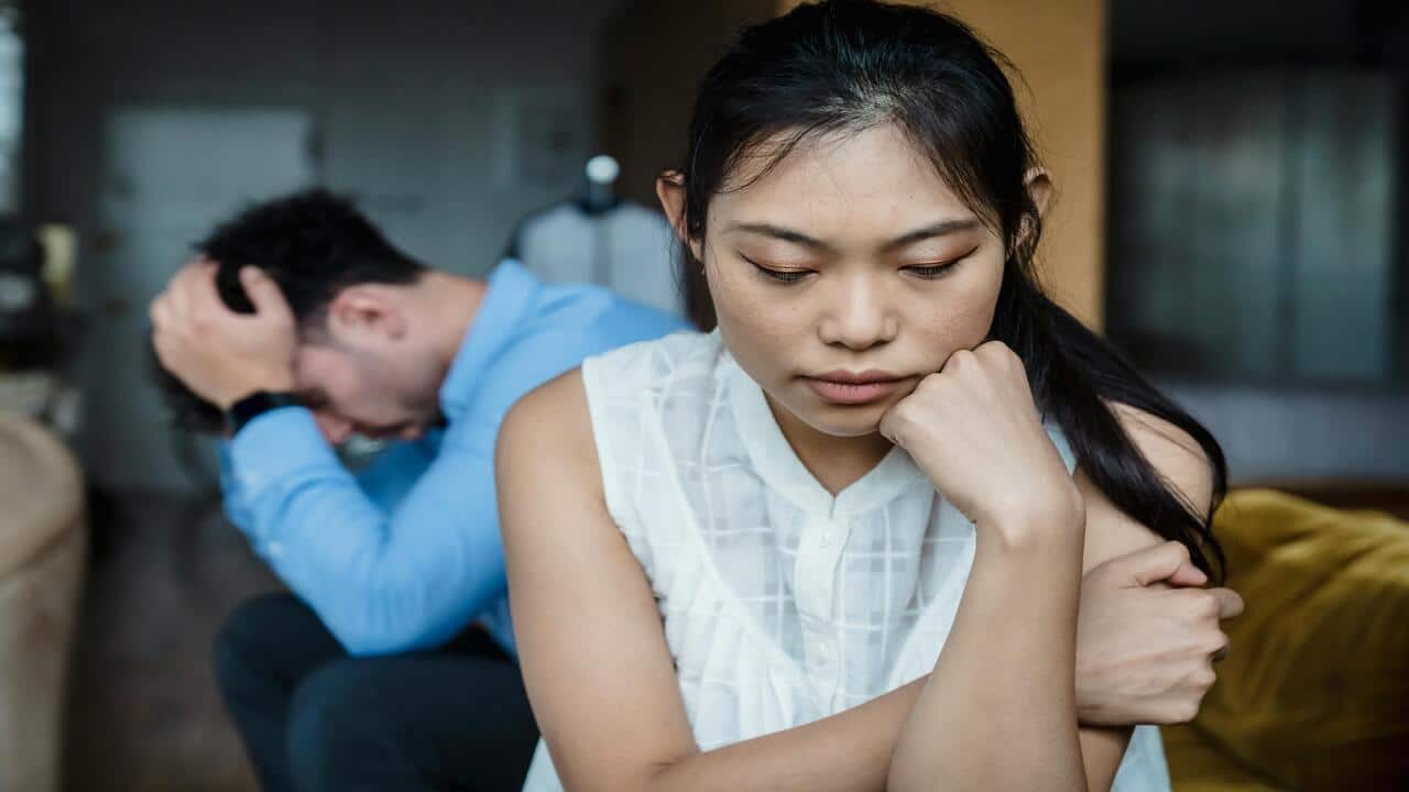 A couple looking sad after an argument