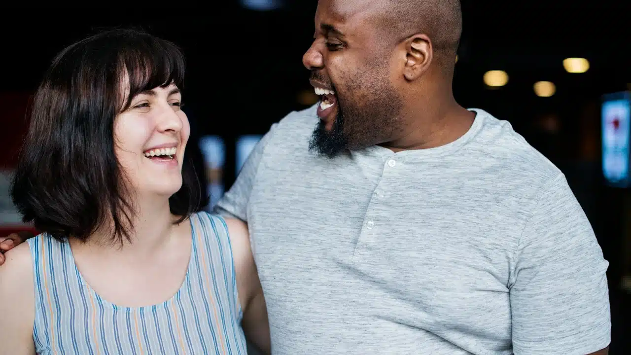 A couple laughing together.