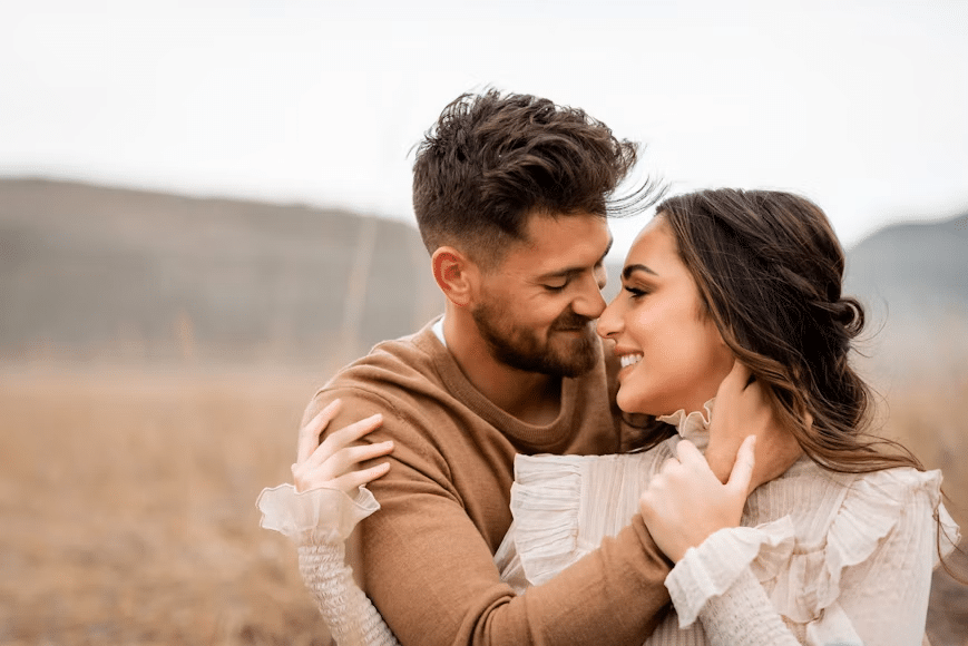 A man and woman looking at each other with love.