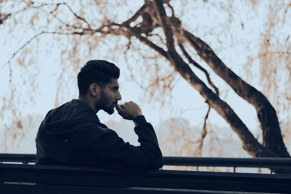 A man lost in self-reflection.