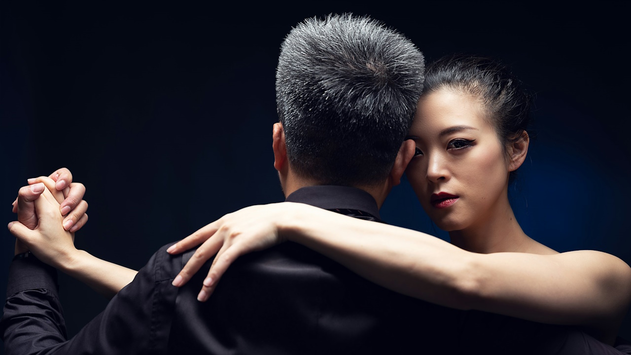 A man and a woman dancing together.