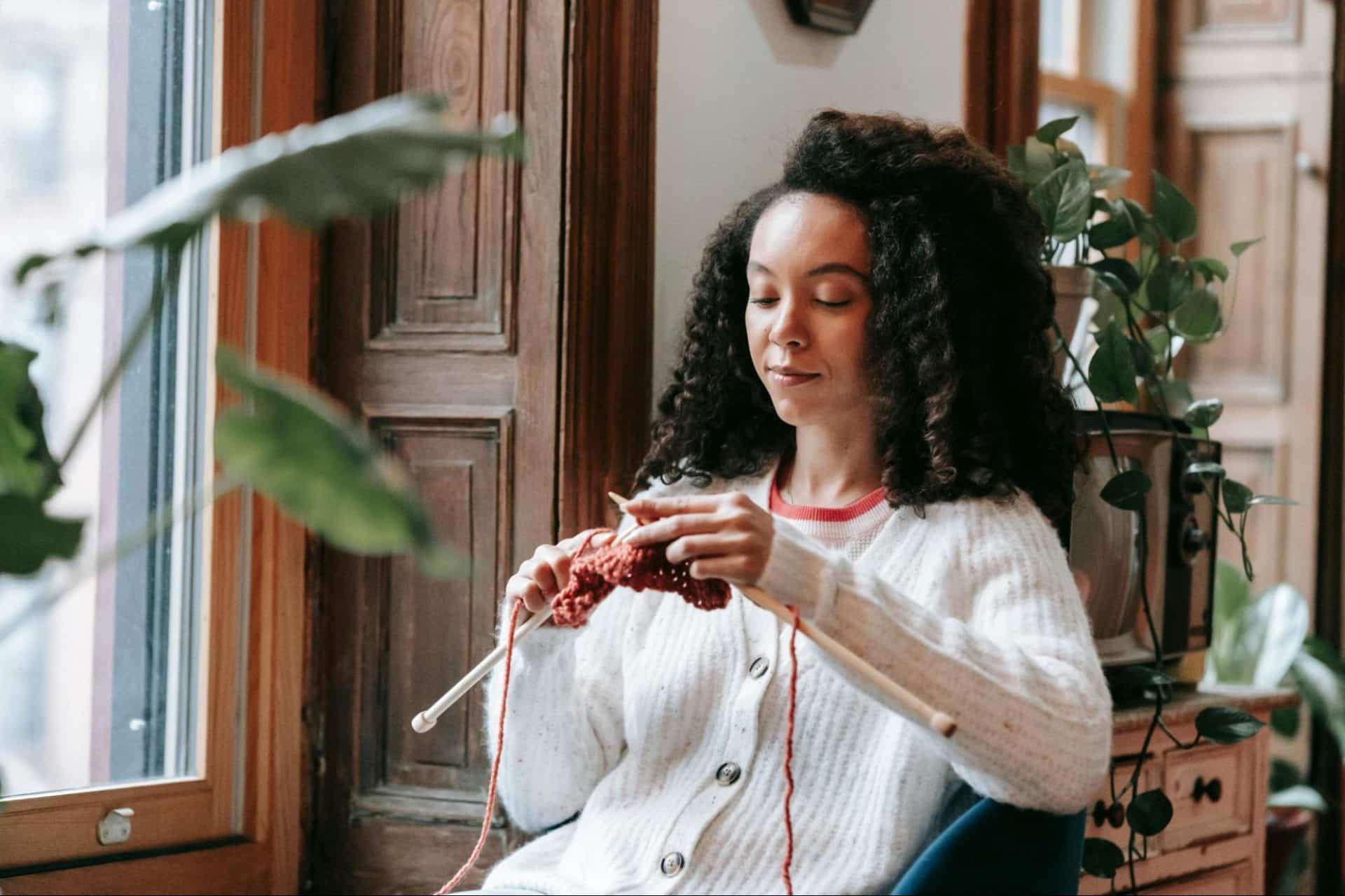 Woman enjoying her hobbies independently with a fulfilled expression