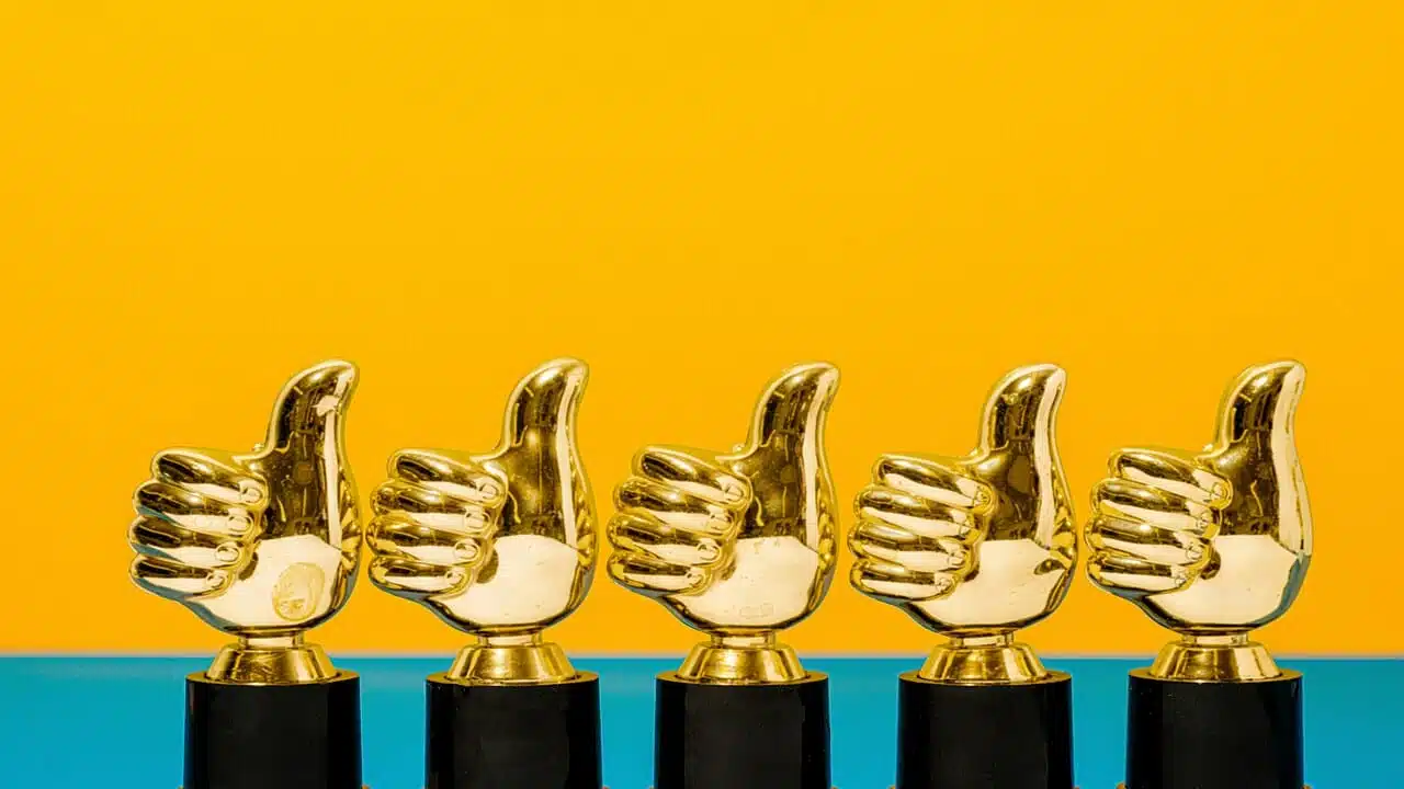 A photo of thumbs up trophies
